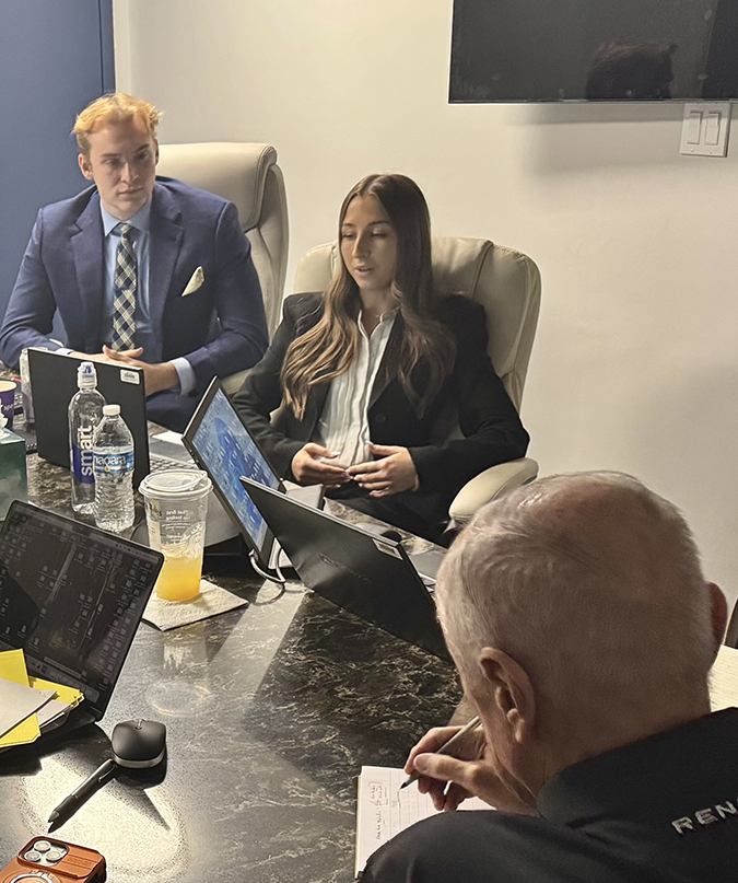 Hali Burnett speaks at a meeting at BNSF headquarters. Next to her is fellow intern Mickey Carrothers.